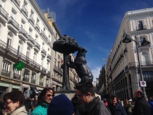 Bear eating fruit of madder tree, one of the symbols of Madrid.