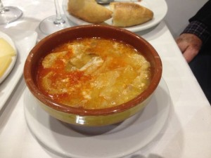 Castillian soup with bread, ham and egg